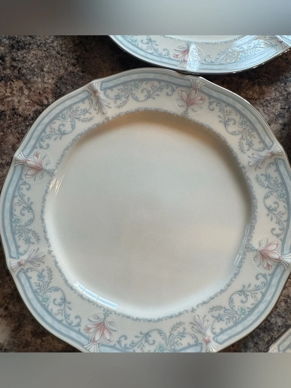 Noritake Crown Flower Dinnerware with Pale Blue and Soft Pink Floral Border